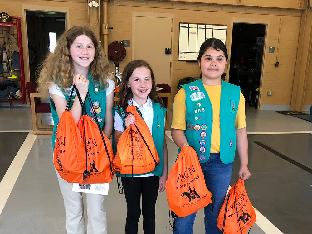 Troop 805 Girl Scouts gather the new kits to be placed on the trucks for the New Windsor Fire Department.